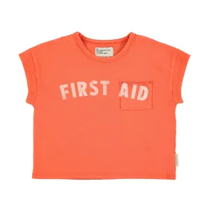 T-Shirt in Orange w/ "First Aid" Print